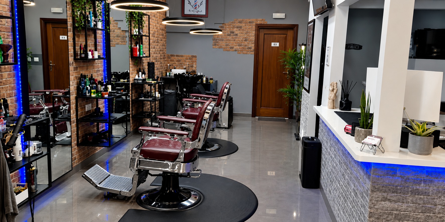 The brick walls, classic barber chairs and contemporary interior of Cascais Barbershop